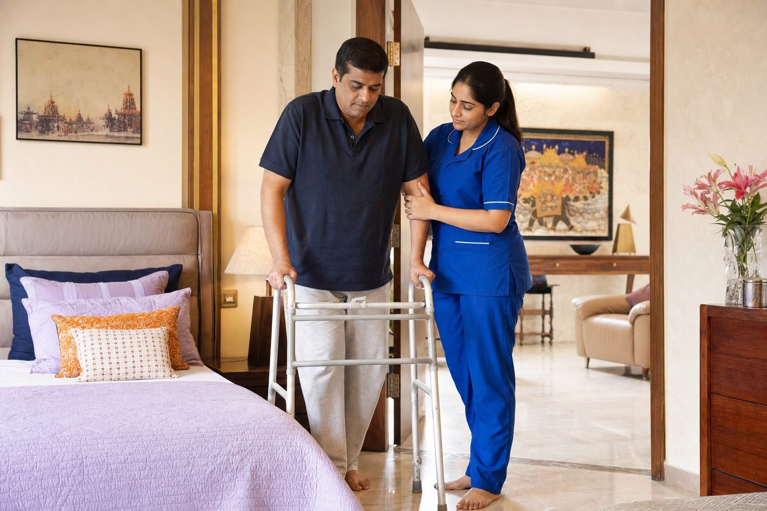 Indian home care attendant supporting a patient with mobility